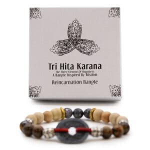 Elegant Tri Hita Karana inspired bracelet symbolising harmony and wisdom, crafted with natural beads and a central black stone, perfect for spiritual and cultural jewellery collections.