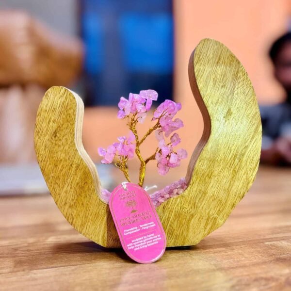 Vibrant pink gemstone wishing tree sculpture in a wooden heart-shaped cradle, symbolising friendship, compassion, and forgiveness, perfect as a heartfelt gift from Sunshine Gifts.