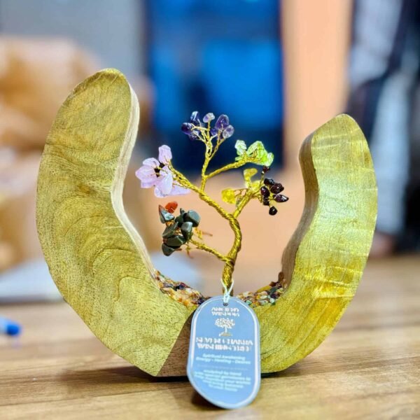 Handcrafted gemstone tree sculpture with colourful stones on a wooden crescent-shaped base, perfect for unique gifts, energy, healing, and decorative home accents.