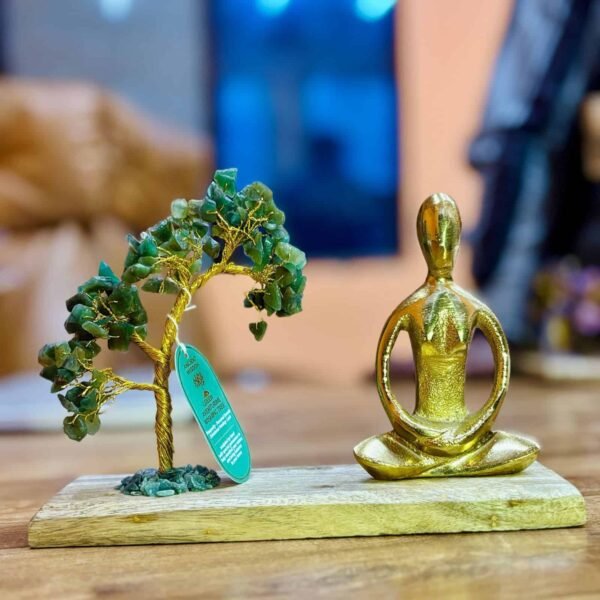 Green gemstone tree and gold meditating figurine decorative set on wooden base for home decor and gift ideas.