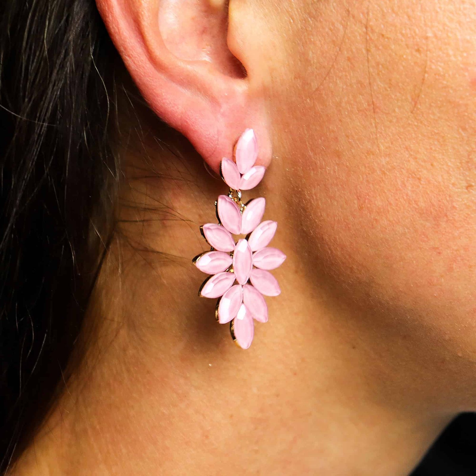 Delicate pink floral drop earrings showcased against a model's ear, perfect as a stylish gift or accessory from Sunshine Gifts, ideal for special occasions and jewellery lovers.