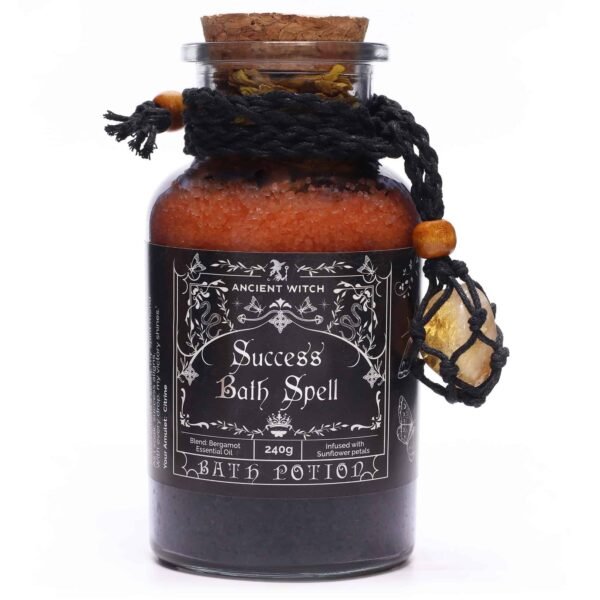 Aromatherapy bath spell in a glass jar with black label, herbal salts, essential oils, and a decorative hanging stone, designed for relaxation, self-care, and mystical spa rituals.