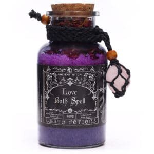 Violet bath salts in a black glass jar with a black rope and rose quartz stone charm for a romantic bath experience, infused with rose flowers and designed for love and relaxation, perfect as a gift.