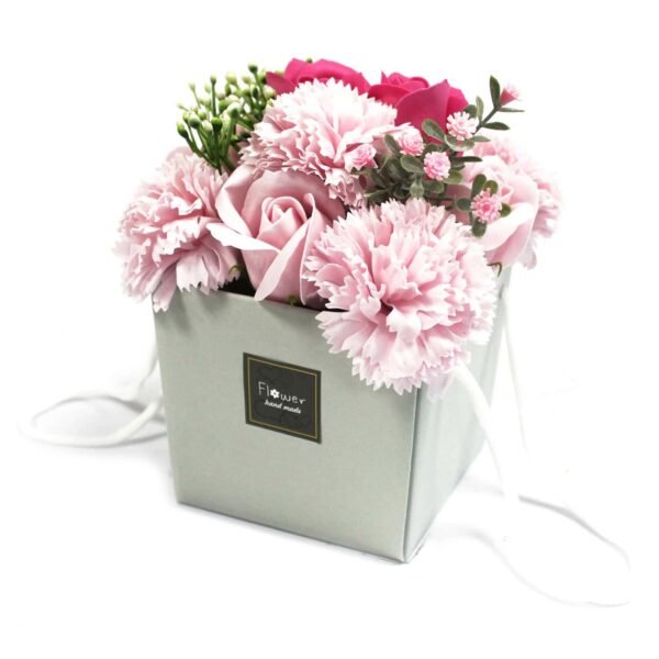 Bright pink roses and carnations arranged in a white gift box with a "flower" label, suitable for gifting or home décor.
