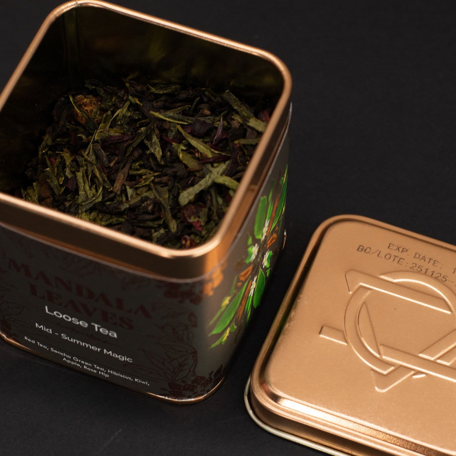Close-up of loose herbal tea leaves in a decorative metal tin container, ideal for gifting or personal use, showcasing high-quality, aromatic tea blends.