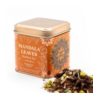 Decorative tin of Mandala Leaves Rooibos Tea with intricate mandala design, featuring organic rooibos tea blend with herbs and spices, ideal for tea lovers.
