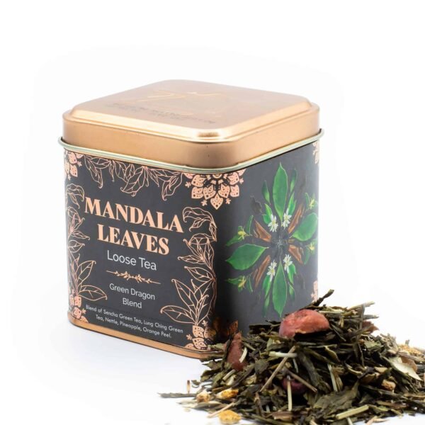 Loose tea in decorative metal tin with mandala leaf design, ideal for gifting or personal use.